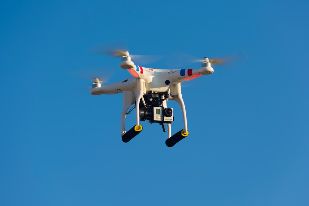 A drone flying near a modern house, suggesting aerial property inspection.